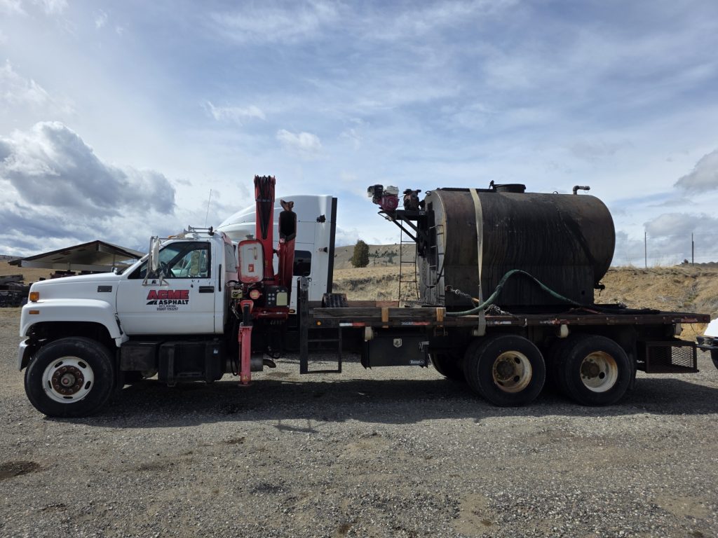 ACME Asphalt truck transporting paving and construction materials