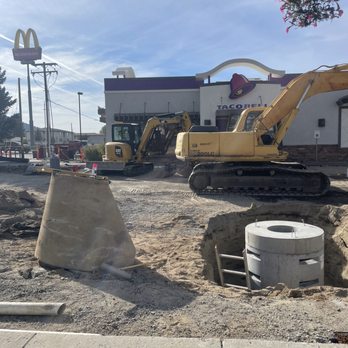 Excavation equipment working on utility and site preparation project at Taco Bell in Butte, MT