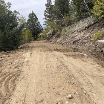 Graded dirt road prepared for asphalt paving in Southwest Montana