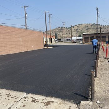 Fresh asphalt parking lot paving completed by ACME Asphalt